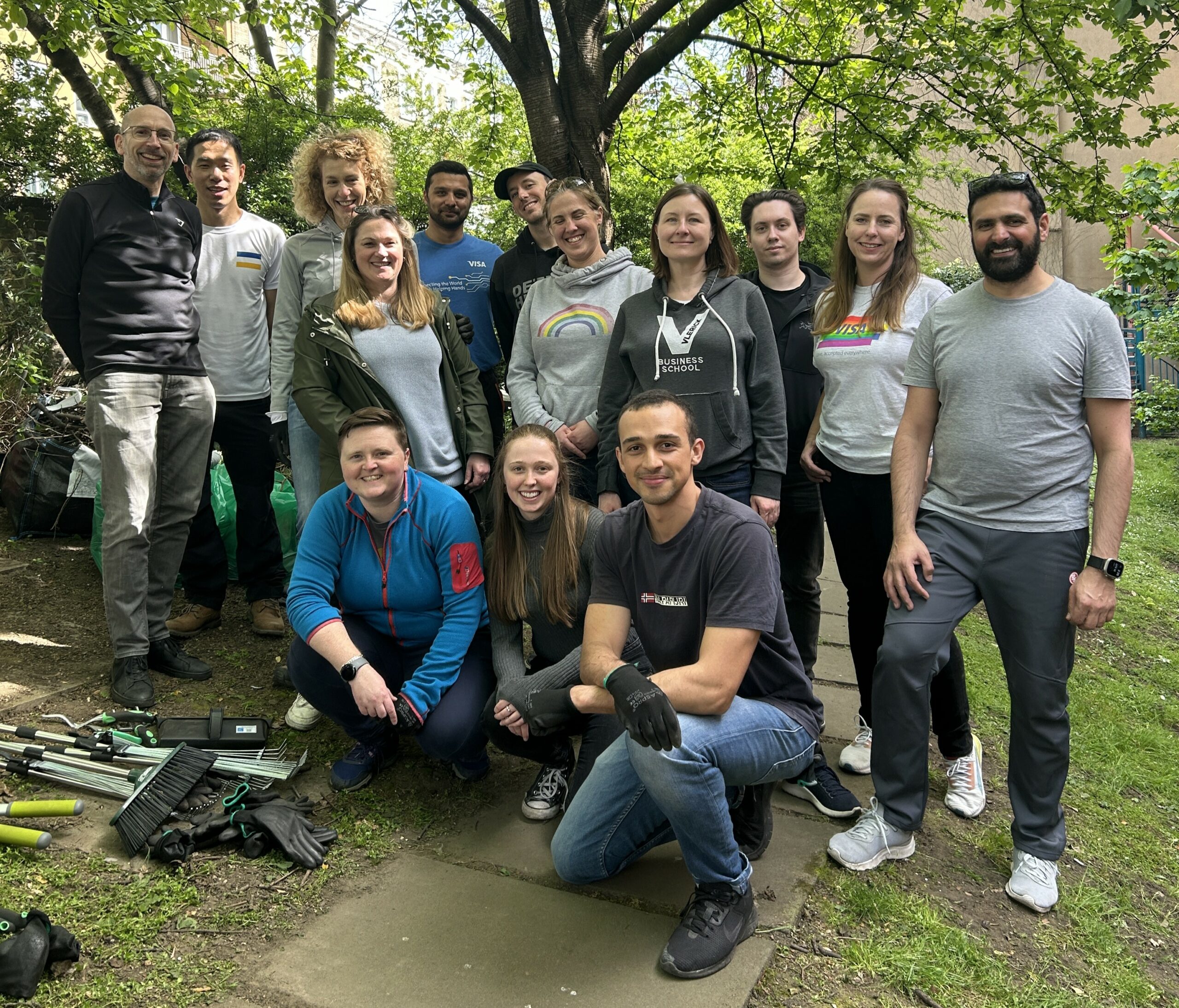 Volunteers from Visa gather for a photo after a gardening project at a Look Ahead homelessness service. The group tidied up the garden in order to improve the customers' quality of life.